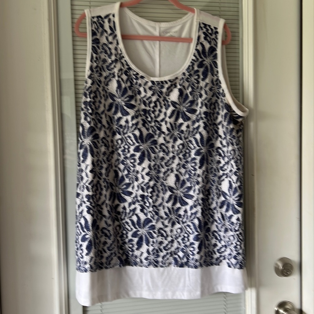 Catherine’s knit white tank top with denim colored lace overlay.